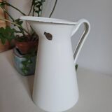 White enamelled metal jug