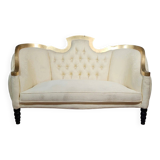 Banquette vintage à dossier capitonné, revêtu d’un tissu ivoire