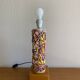 Openwork ceramic lamp base with Garden of Eden decor