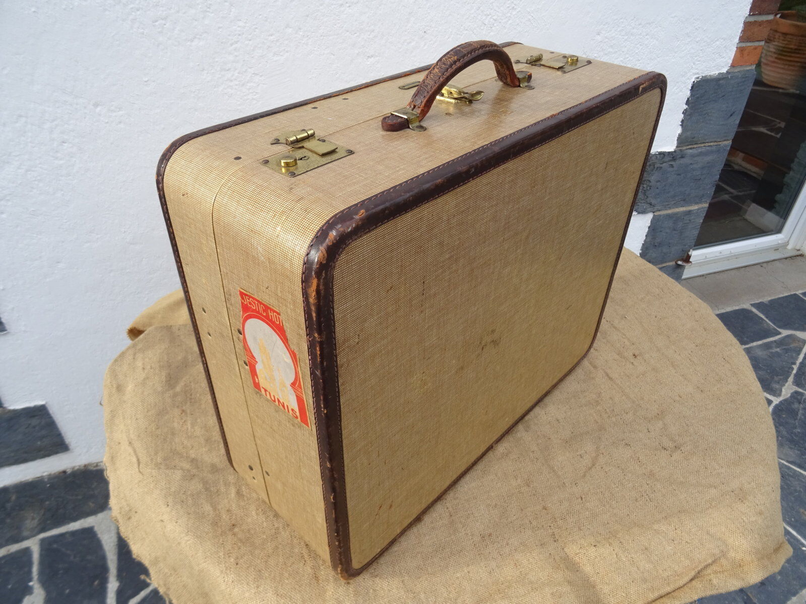 1930s Oshkosh suitcase with bakelite hangers