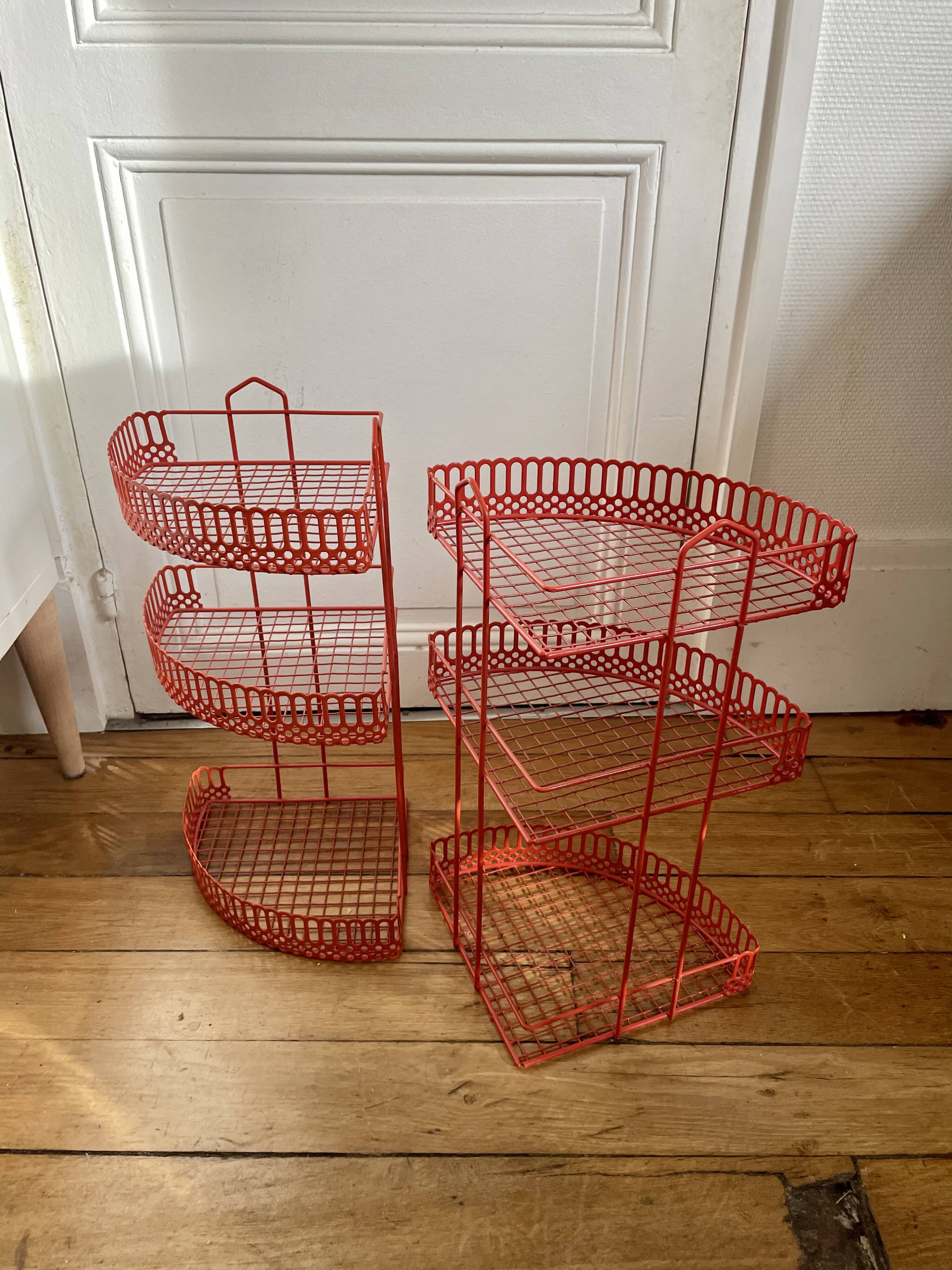 Red enamelled metal wall shelves