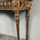 Louis XVI style console in carved wood with a gilded patina, 19th century.