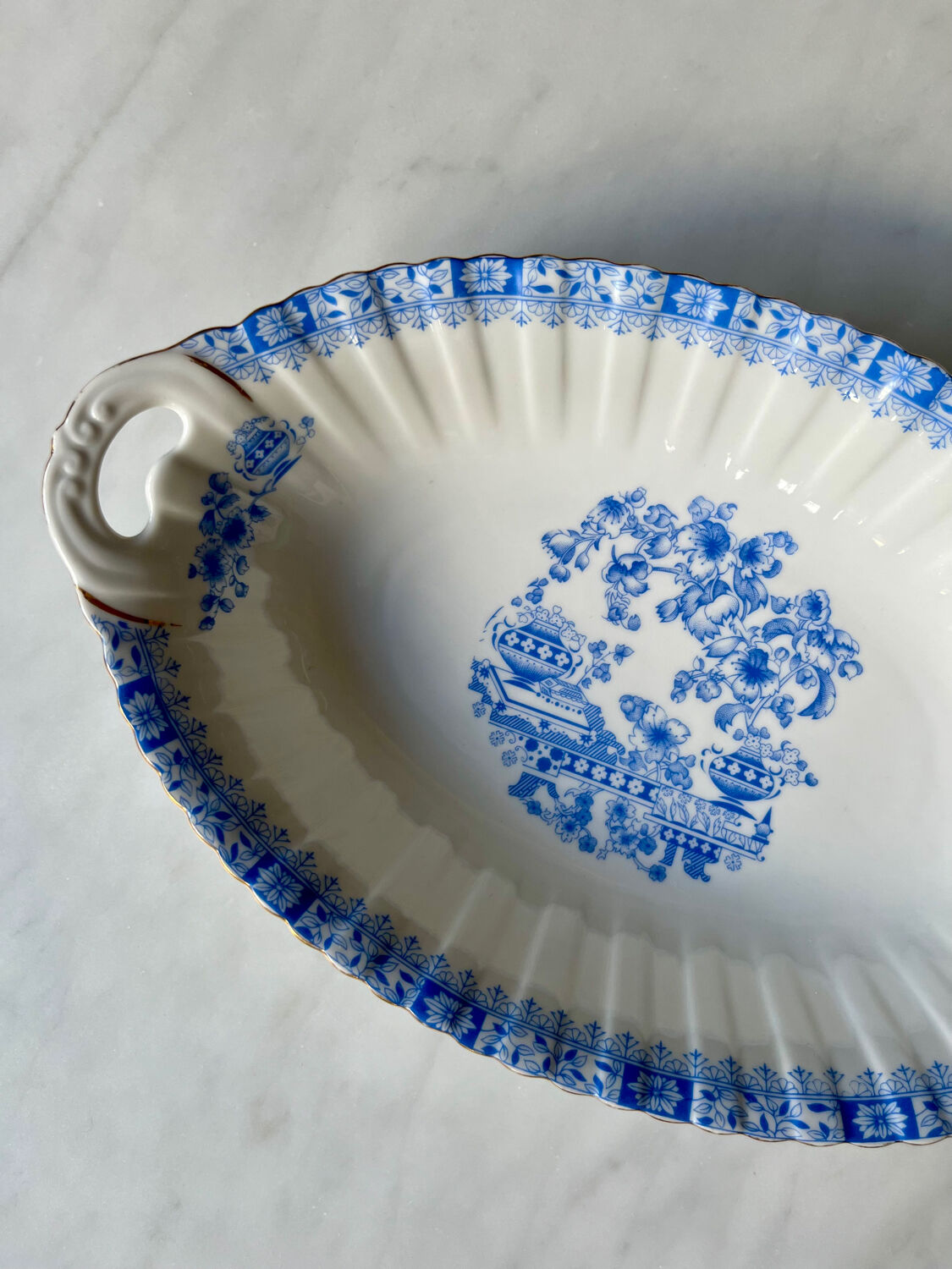 Antique oval dish with handles in earthenware