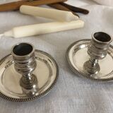Two silver metal candlesticks