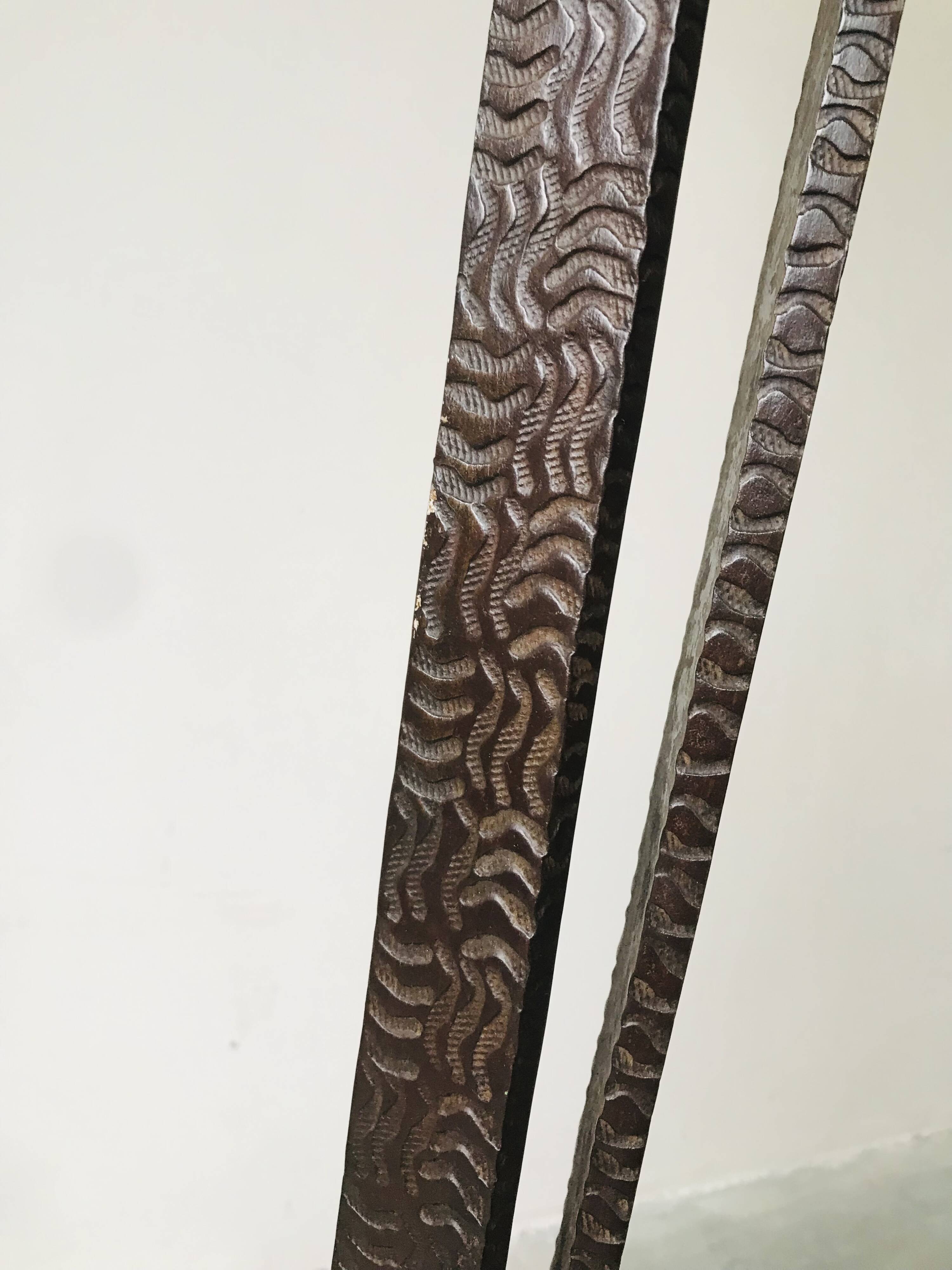 Art deco wrought iron floor lamp decorated with flowers, circa 1930.