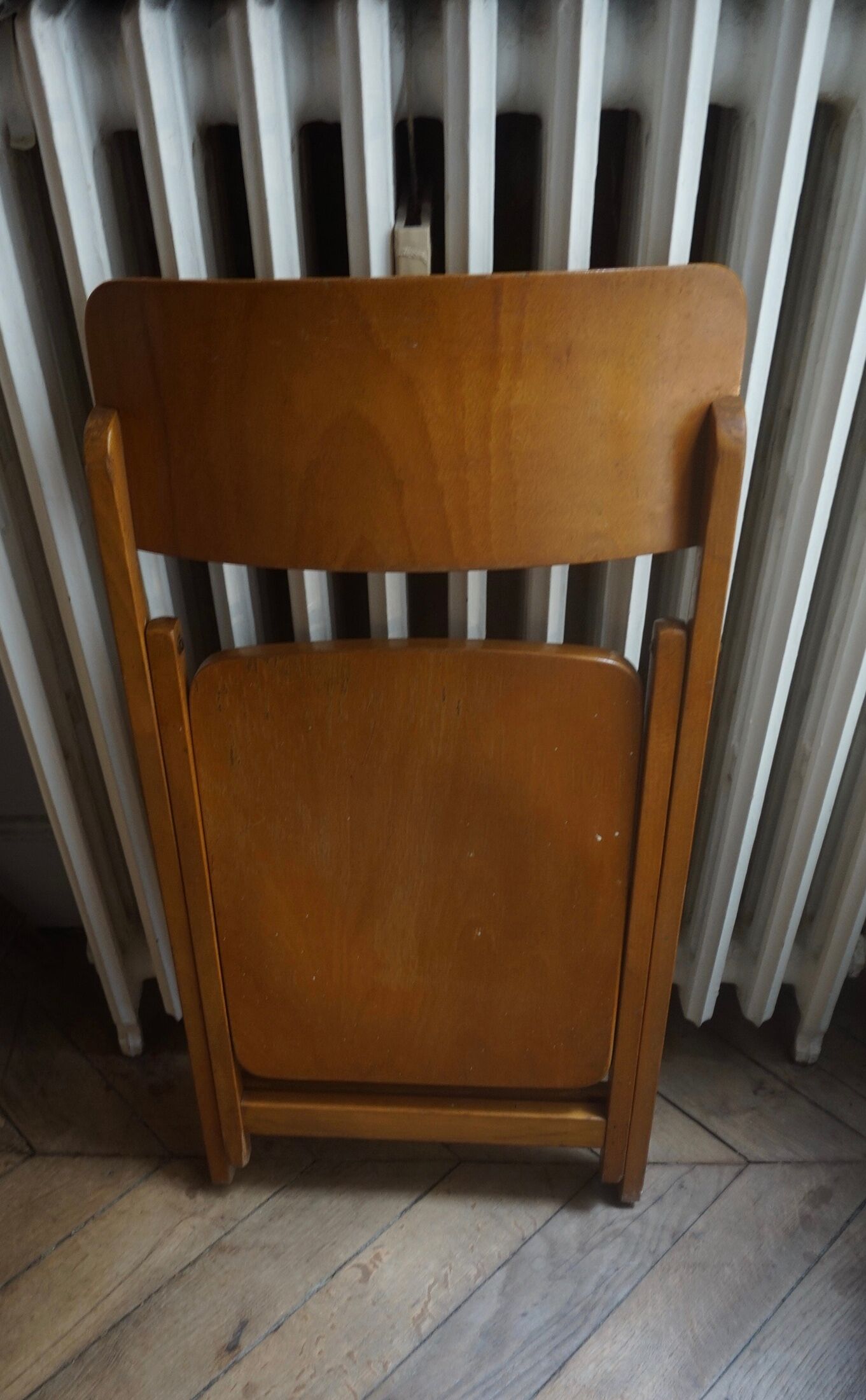 Vintage folding wooden heater chair