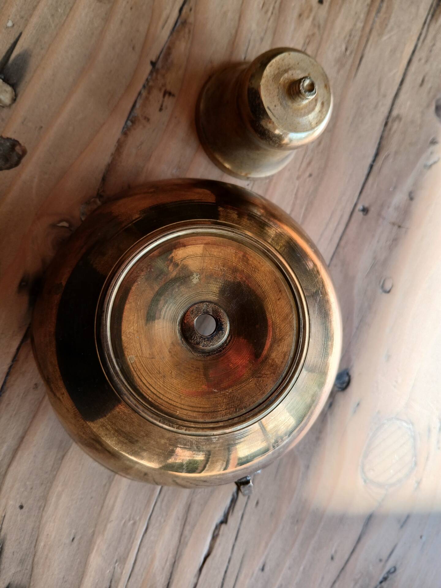 Brass candle holder in the shape of a flower.