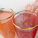 6 colorful juice glasses in their vintage basket