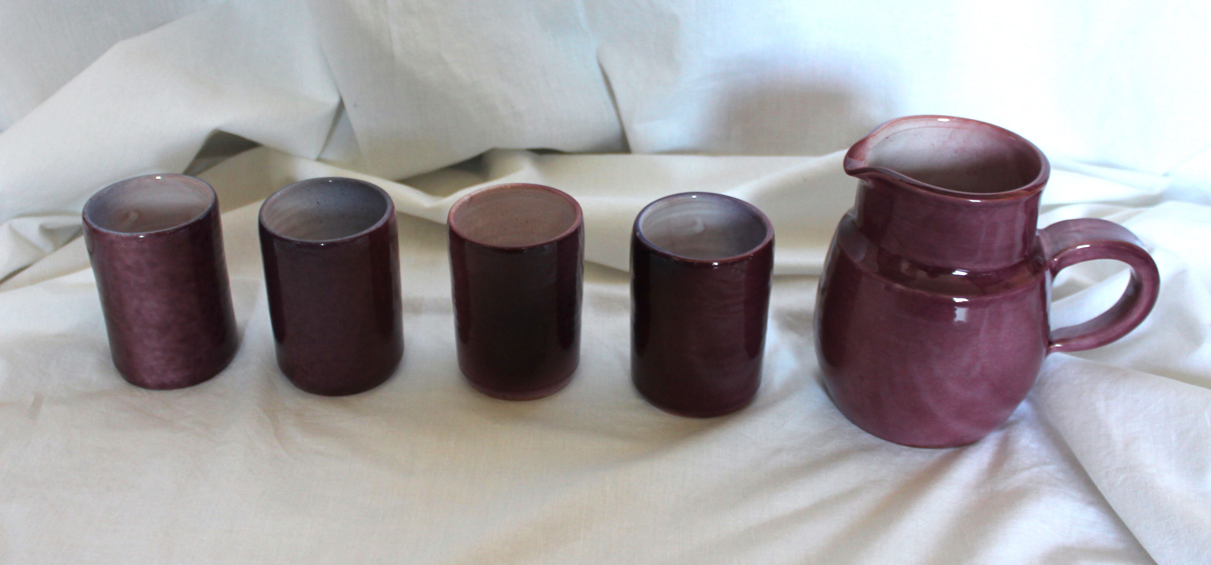 Purple ceramic pitcher and glasses set