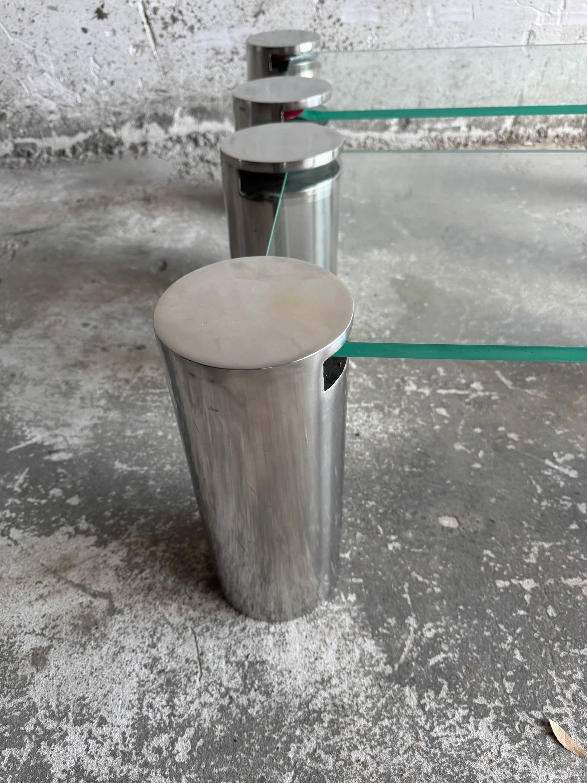 Pair of modernist coffee tables with cylindrical steel legs