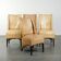 Set of four cowhide dining chairs with a comfortable seat and high back
