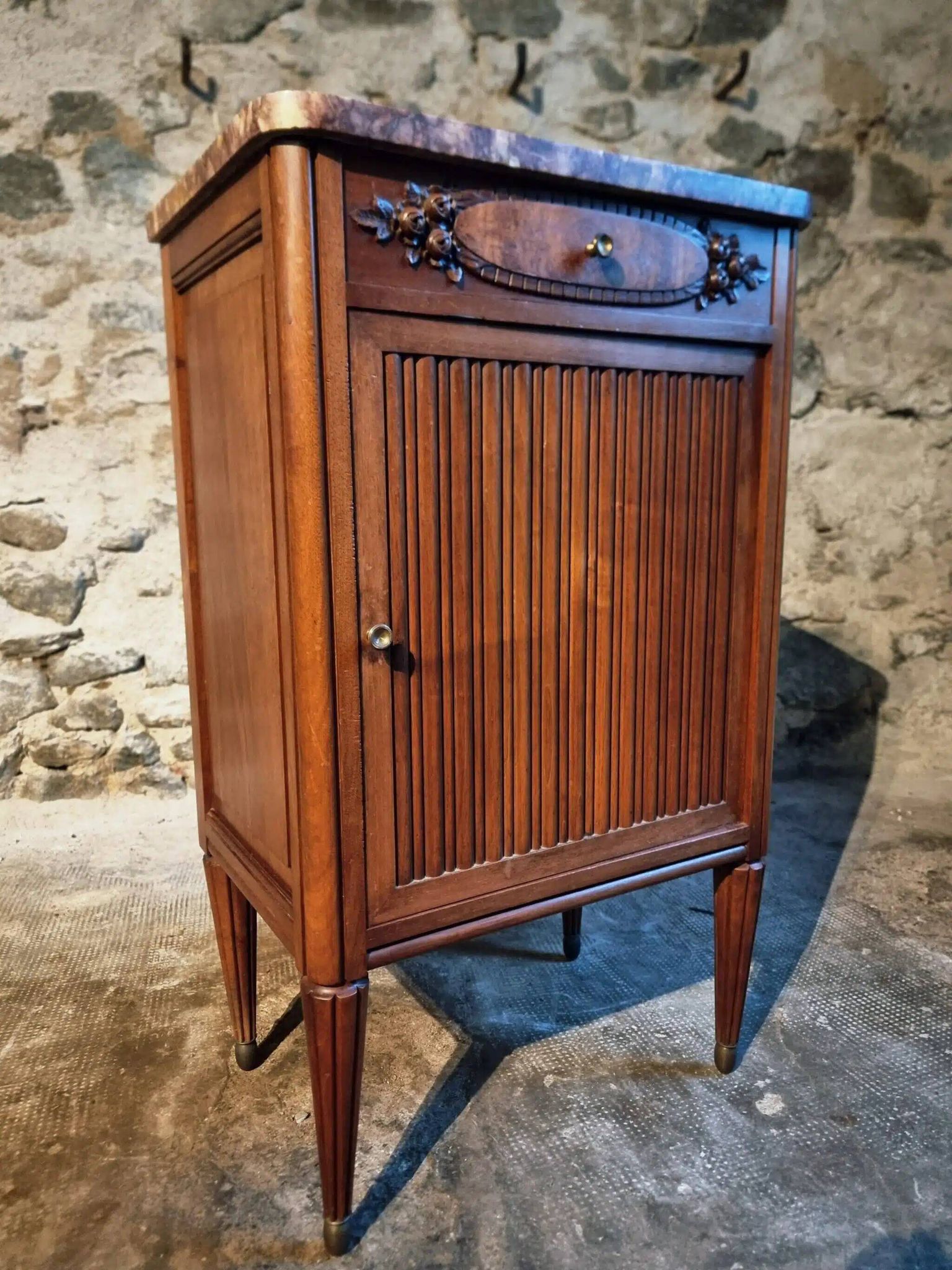 French antique bedside table in walnut with a marble top and porcelain interior, early 20th century.
