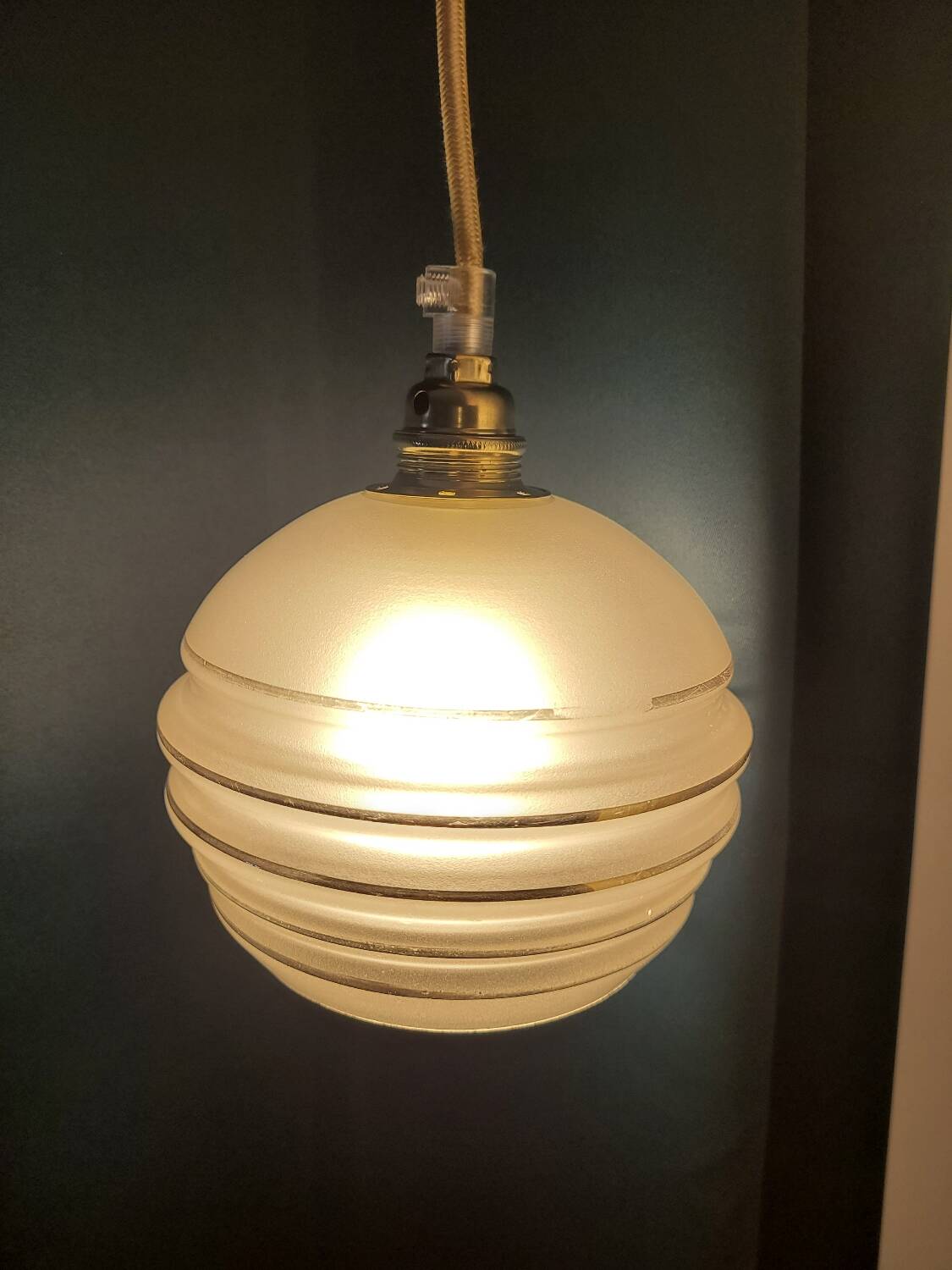 Frosted glass lamp with golden trims