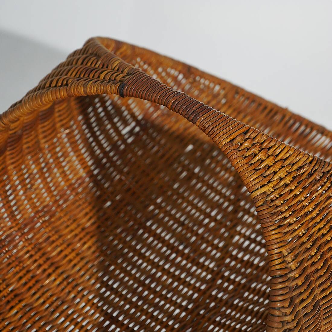 Rattan magazine rack with metal legs, 1950s