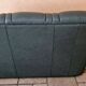 Three-seater sofa in green leather with a solid wood frame