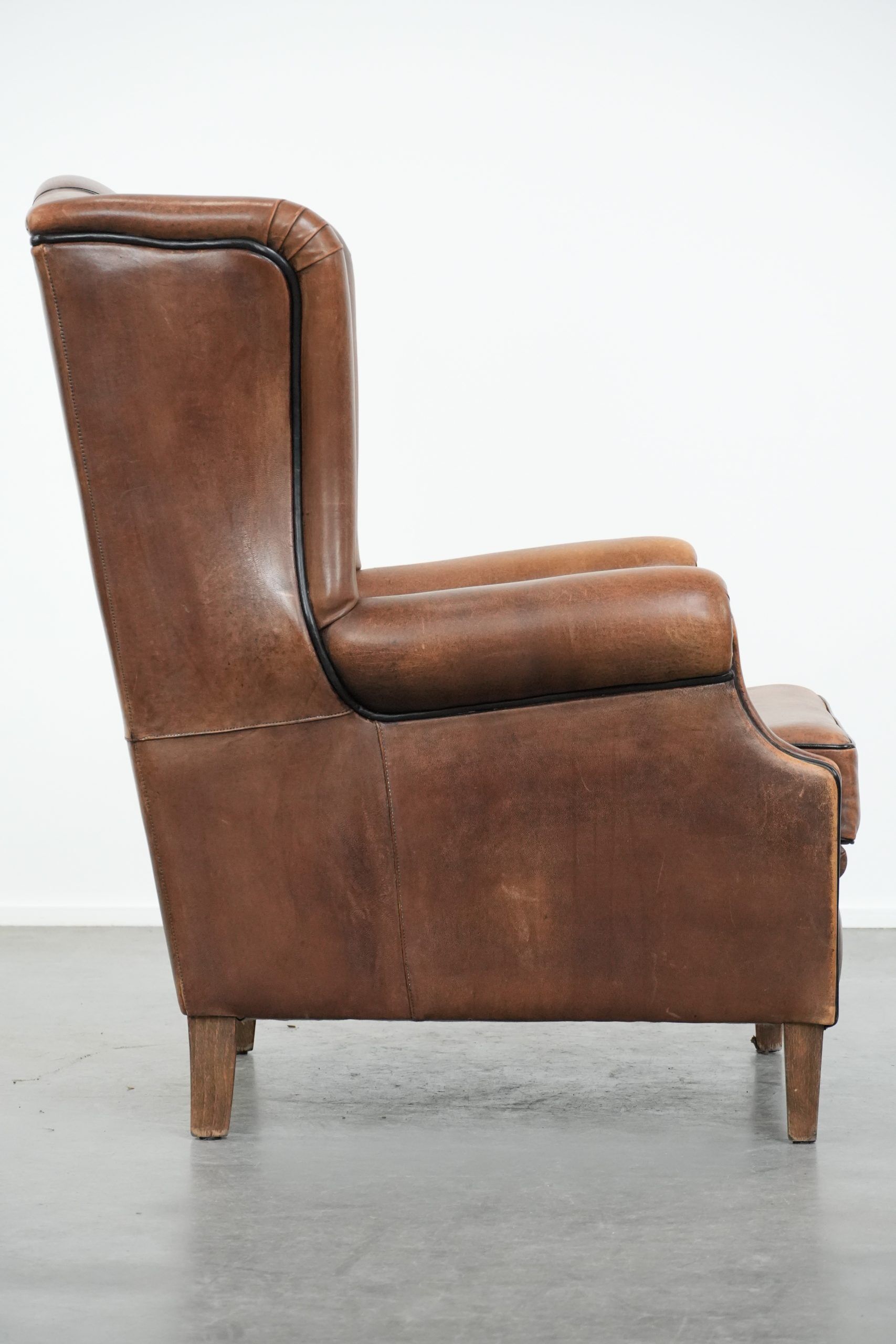 Sheepskin wingback armchair with beautiful colours in good condition