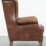 Sheepskin wingback armchair with beautiful colours in good condition