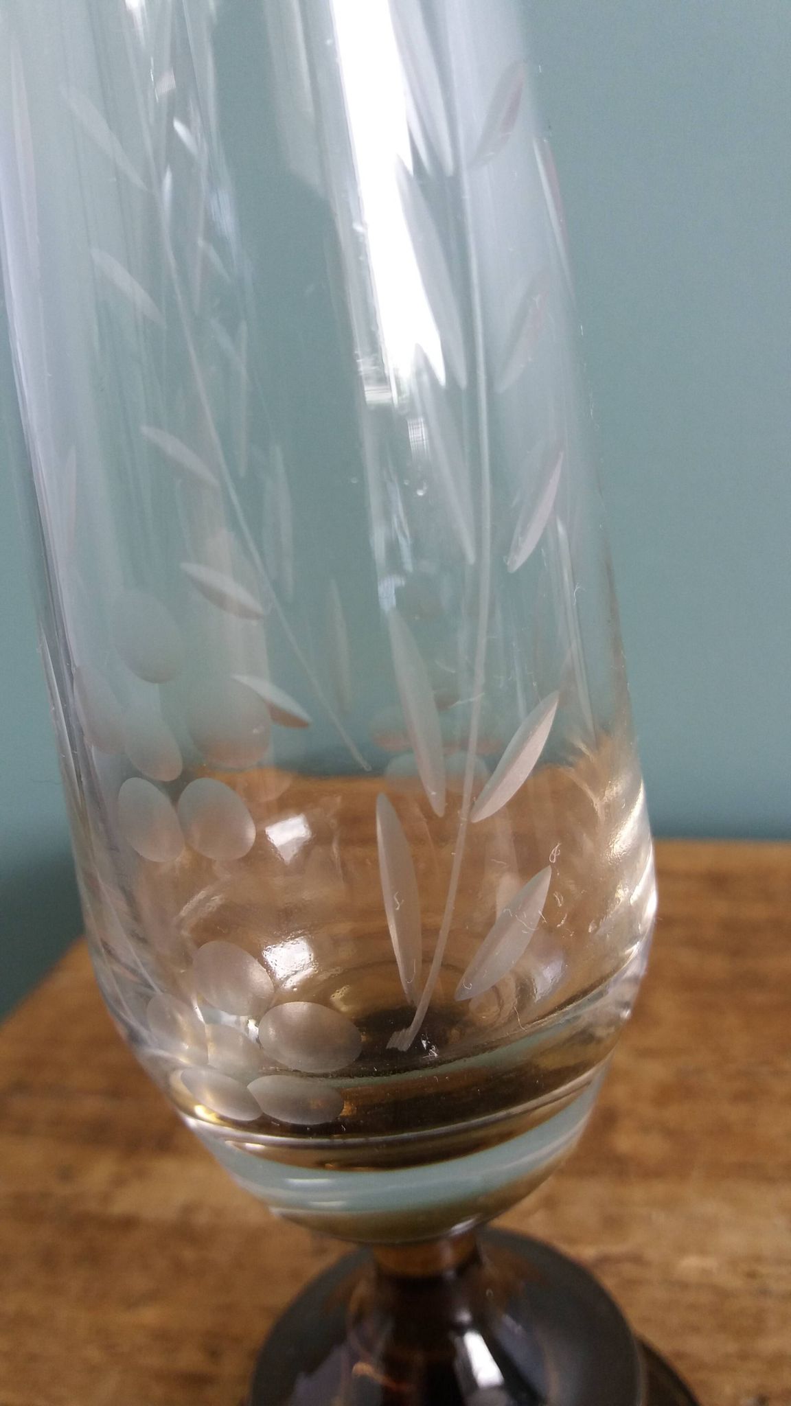 Cut glass soliflore vase with a smoked glass base.