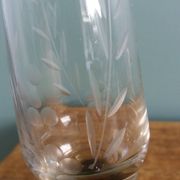 Cut glass soliflore vase with a smoked glass base.