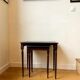 Dark wood and black leather tables