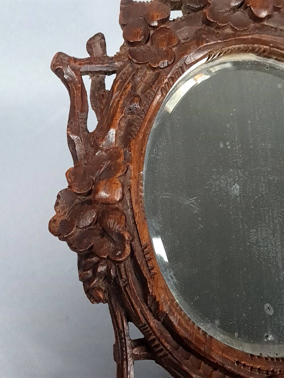 Antique small beveled mirror with carved wooden frame and waxed patina C714