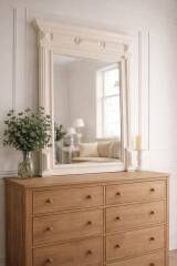 Miroir ancien biseauté, cadre en bois et stuc patiné gris perle.