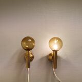 Set of solid brass wall lamps with smoked glass domes