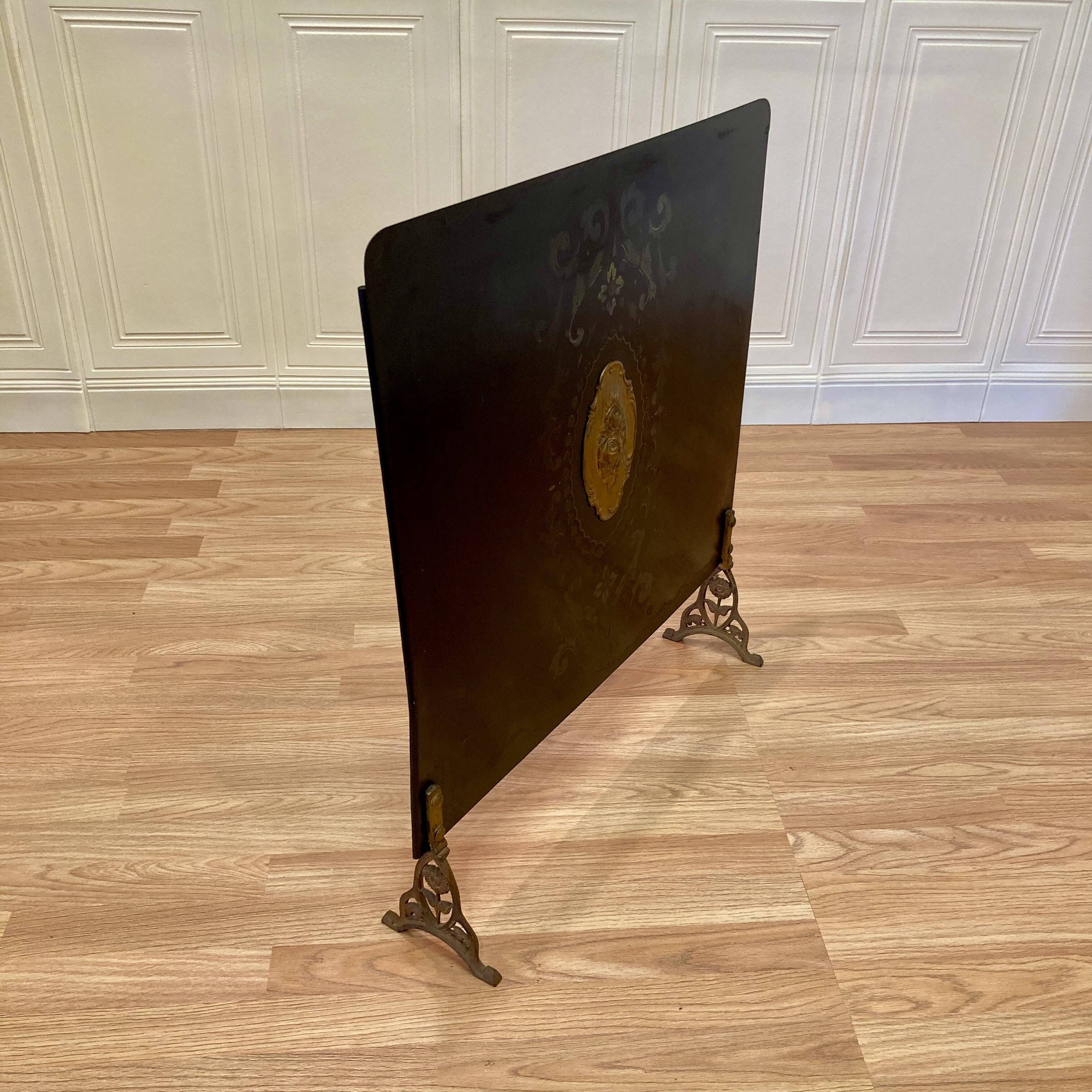 Antique metal fireplace screen.