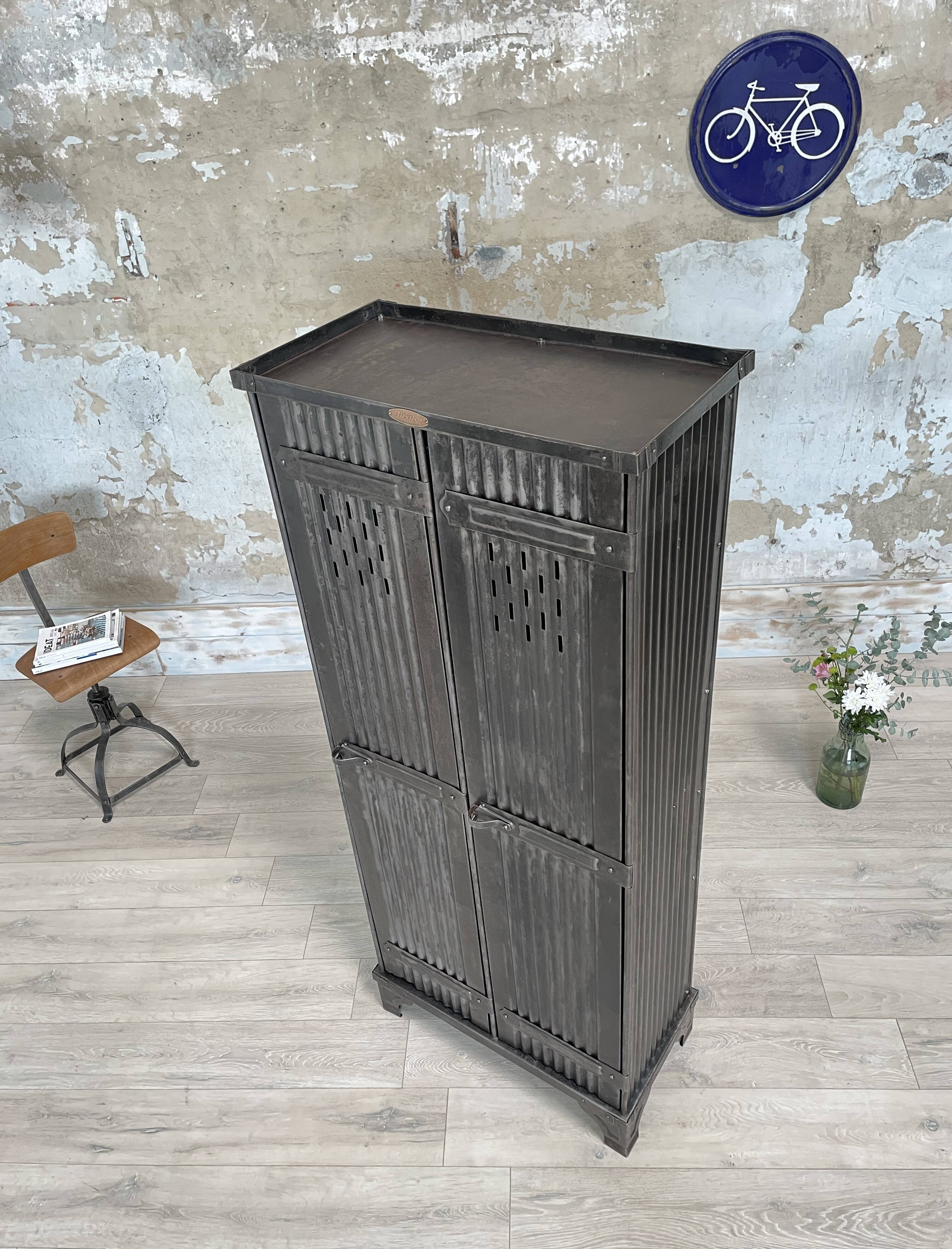 Strafor double-door corrugated iron cloakroom, circa 1920.