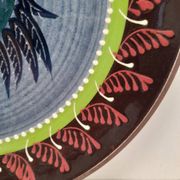 Assiette murale en céramique oiseau folklorique
