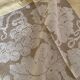 Tablecloth and 12 straw-colored napkins from the 50s.