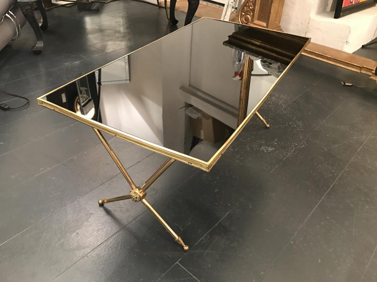 Golden brass table and lion heads circa 1950