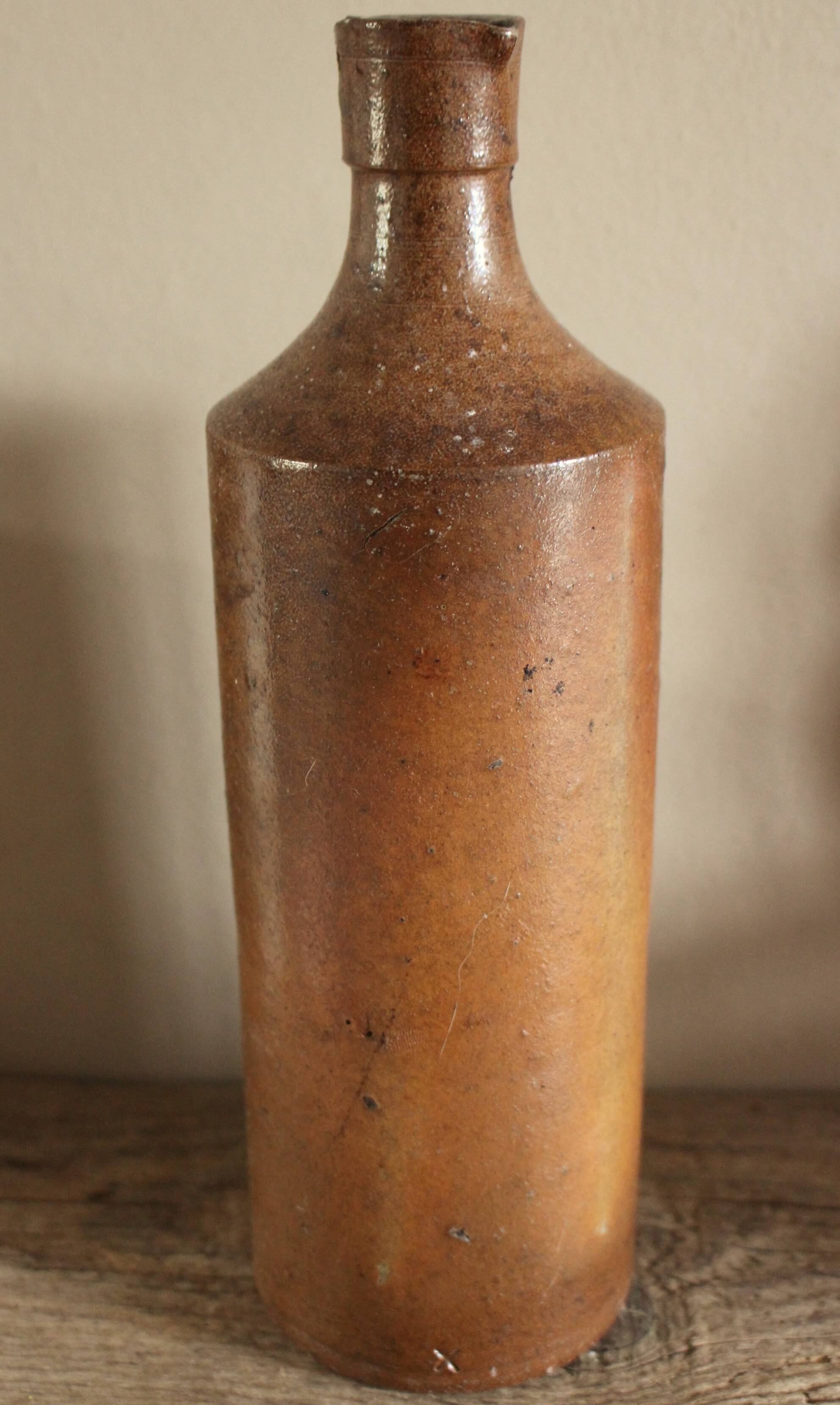 Vintage stoneware liqueur bottle with pouring spout