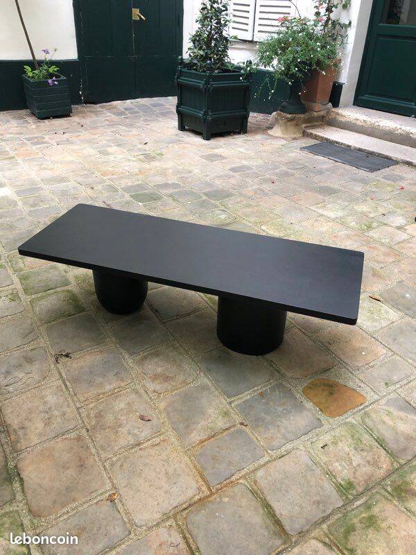 Rectangular coffee table in stained black wood with ball and cylindrical legs.