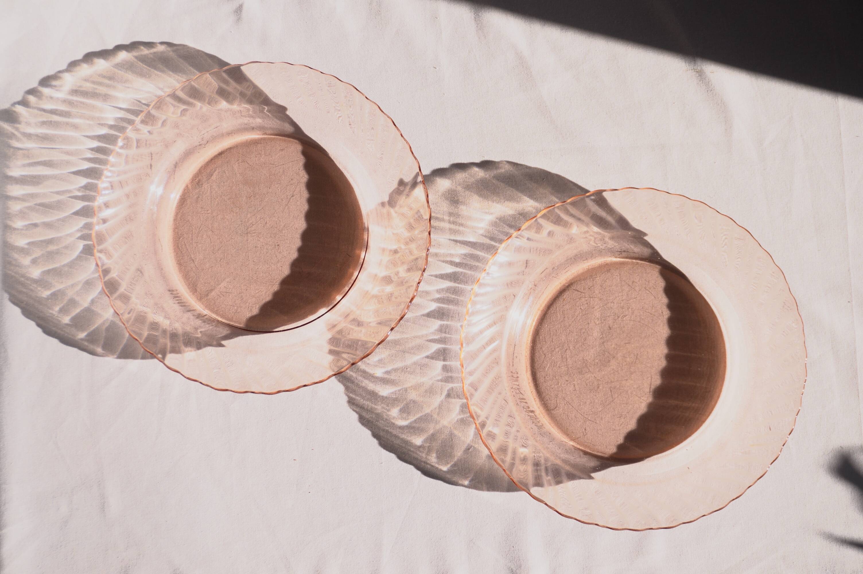 Set of two pink glass plates, Arcoroc France