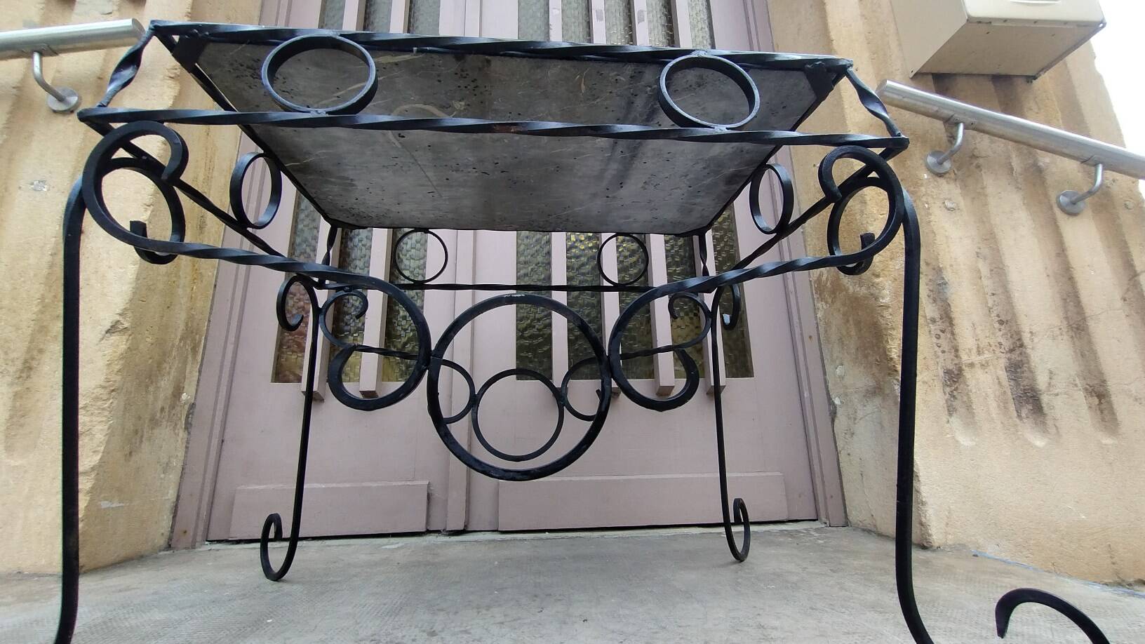 Wrought iron coffee table with black marble top