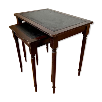 Dark wood and black leather tables