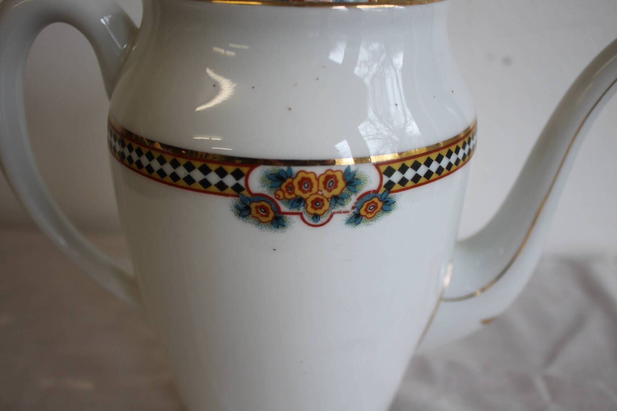 Antique coffee pot in white Limoges porcelain with floral motifs