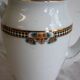 Antique coffee pot in white Limoges porcelain with floral motifs