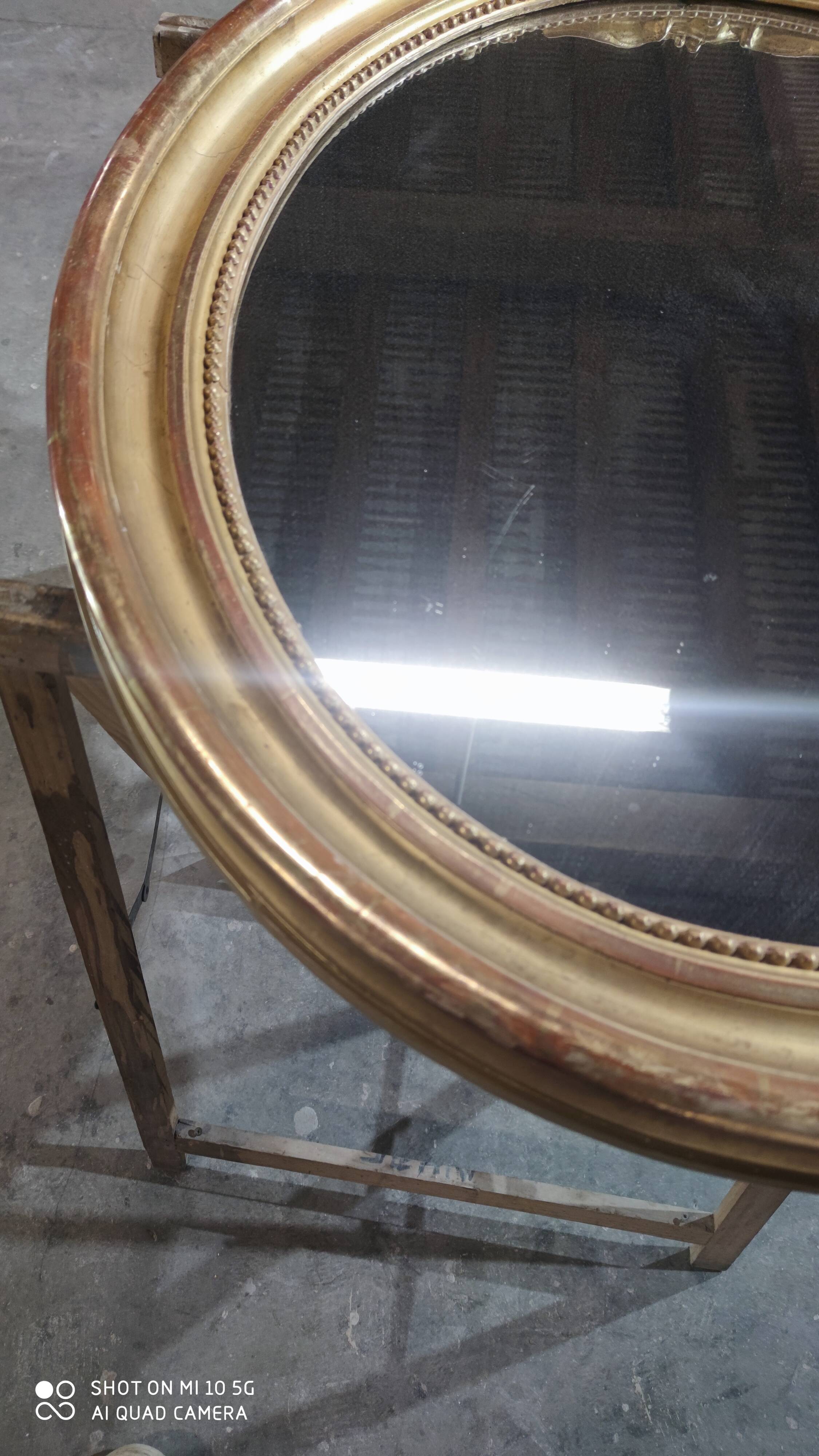 Mirror with a gilt medallion pediment, 1840