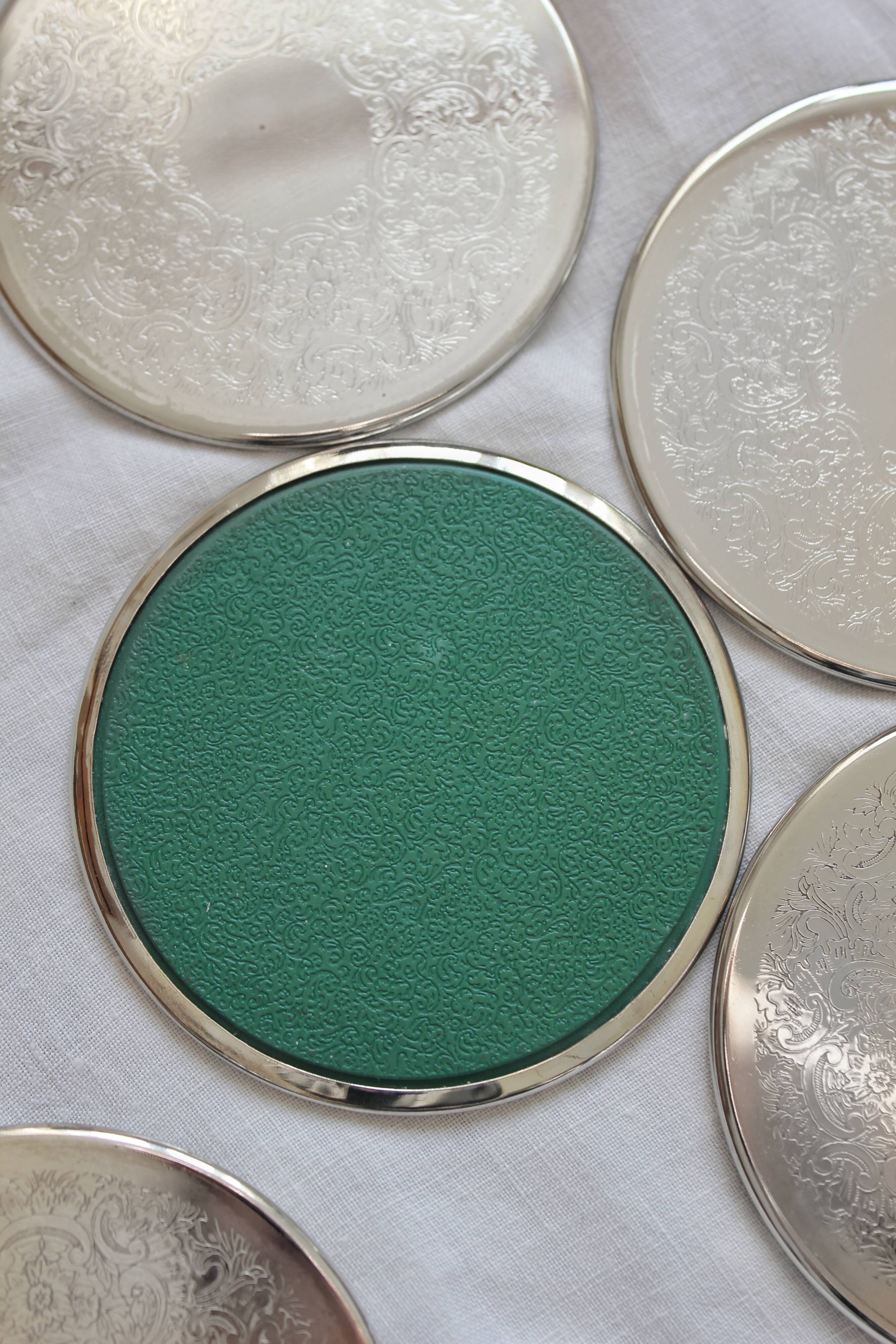 6 vintage chiseled silver metal coasters