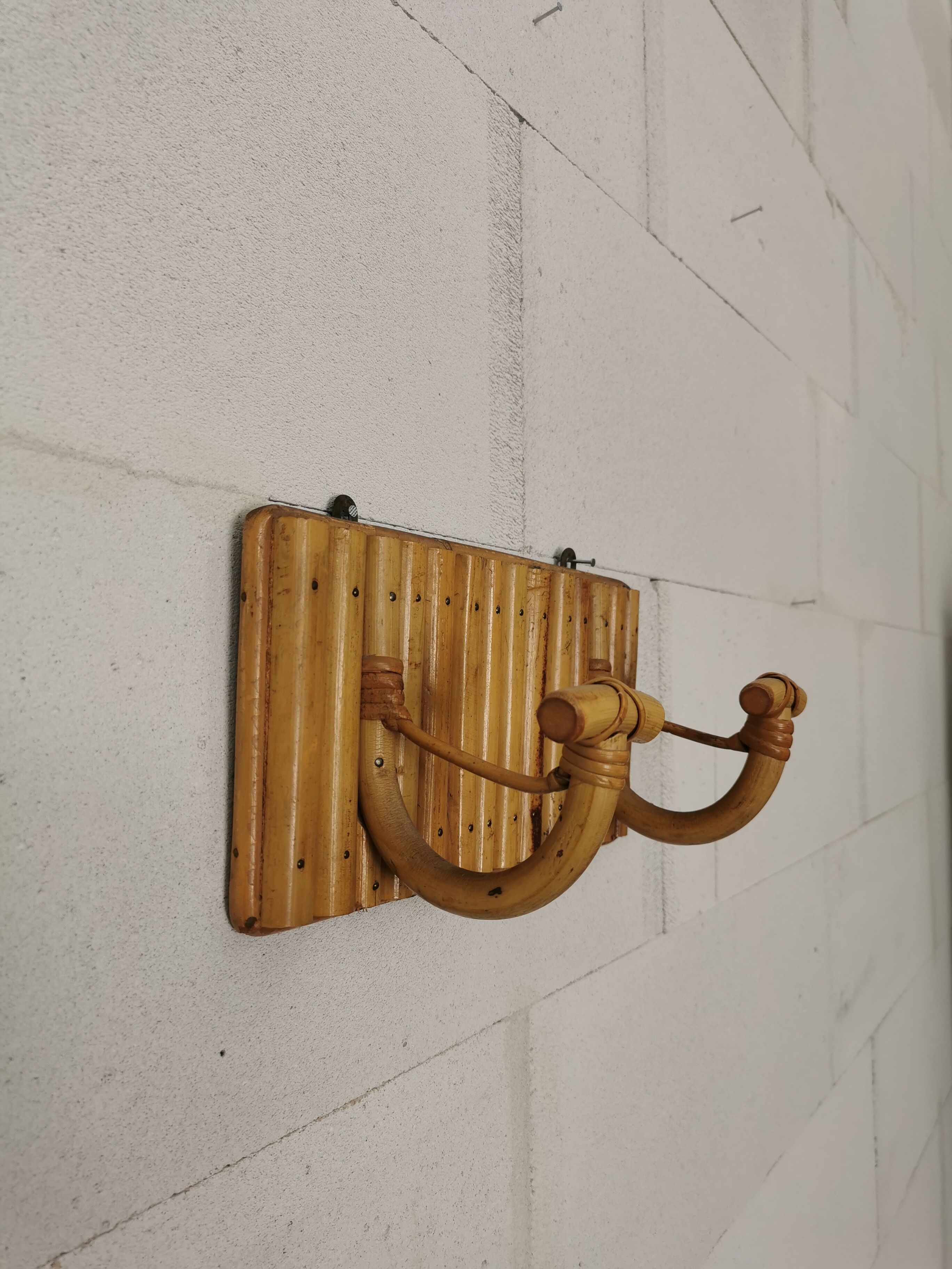 Wall coat holder in rattan