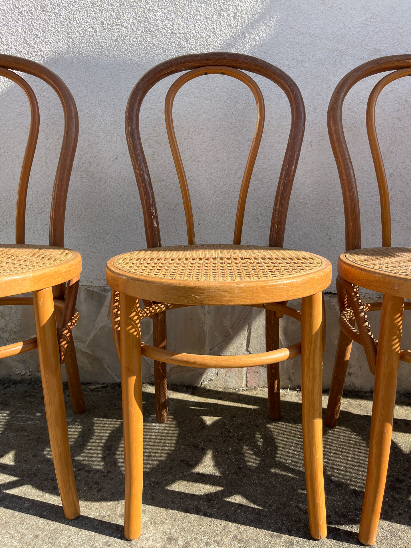 Set of 4 bentwood bistro chairs with caning.