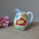 Old small jug, handmade ceramic milk pot with hand-painted floral decoration in the Vallauris style.