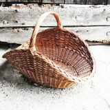 Old basket with logs in light wicker