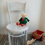 White antique children's chair in patinated wood