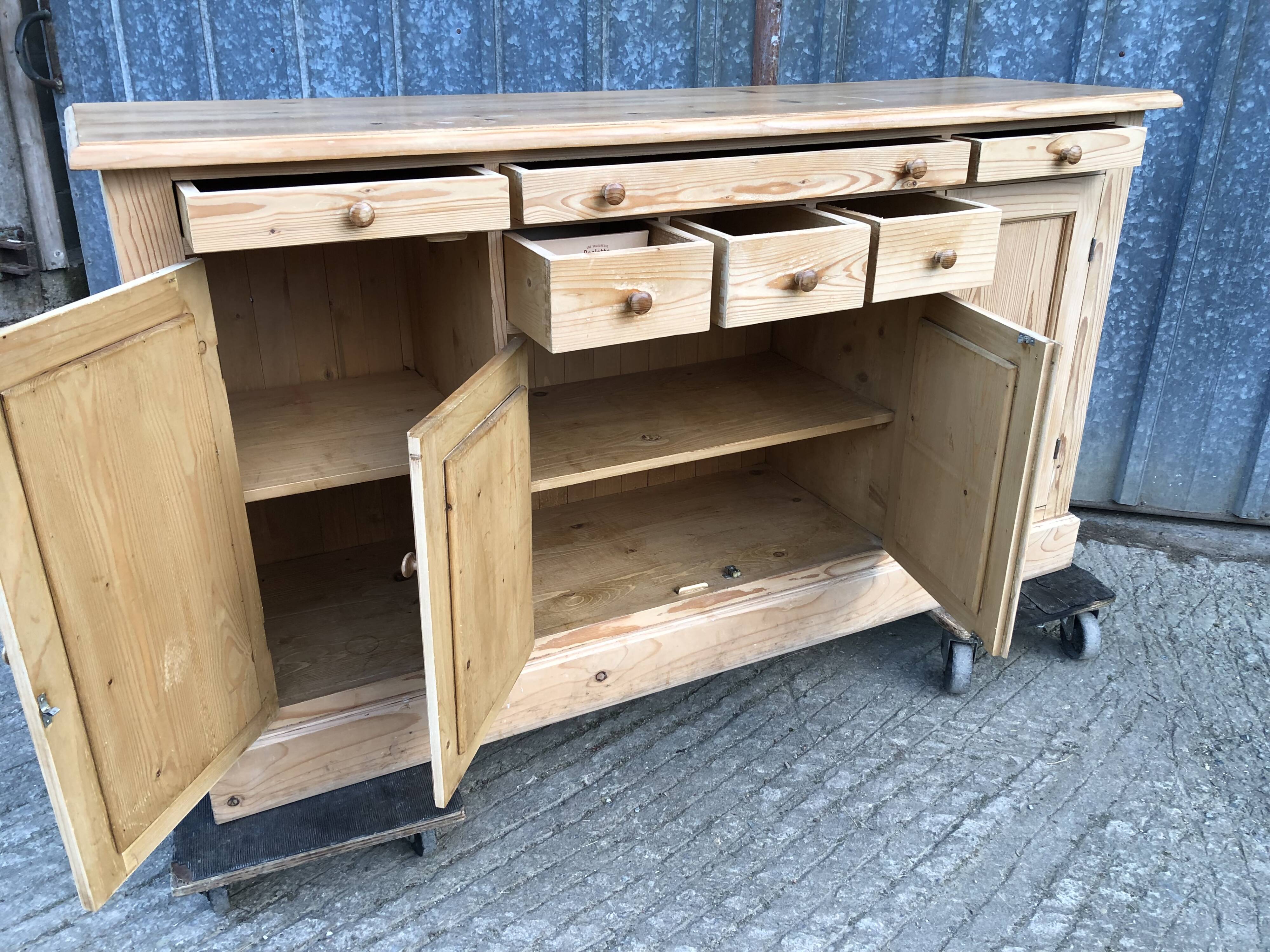 Scandinavian natural pine sideboard with 4 doors and 6 drawers.