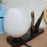 Art Deco swan and white globe table lamp with black marble base