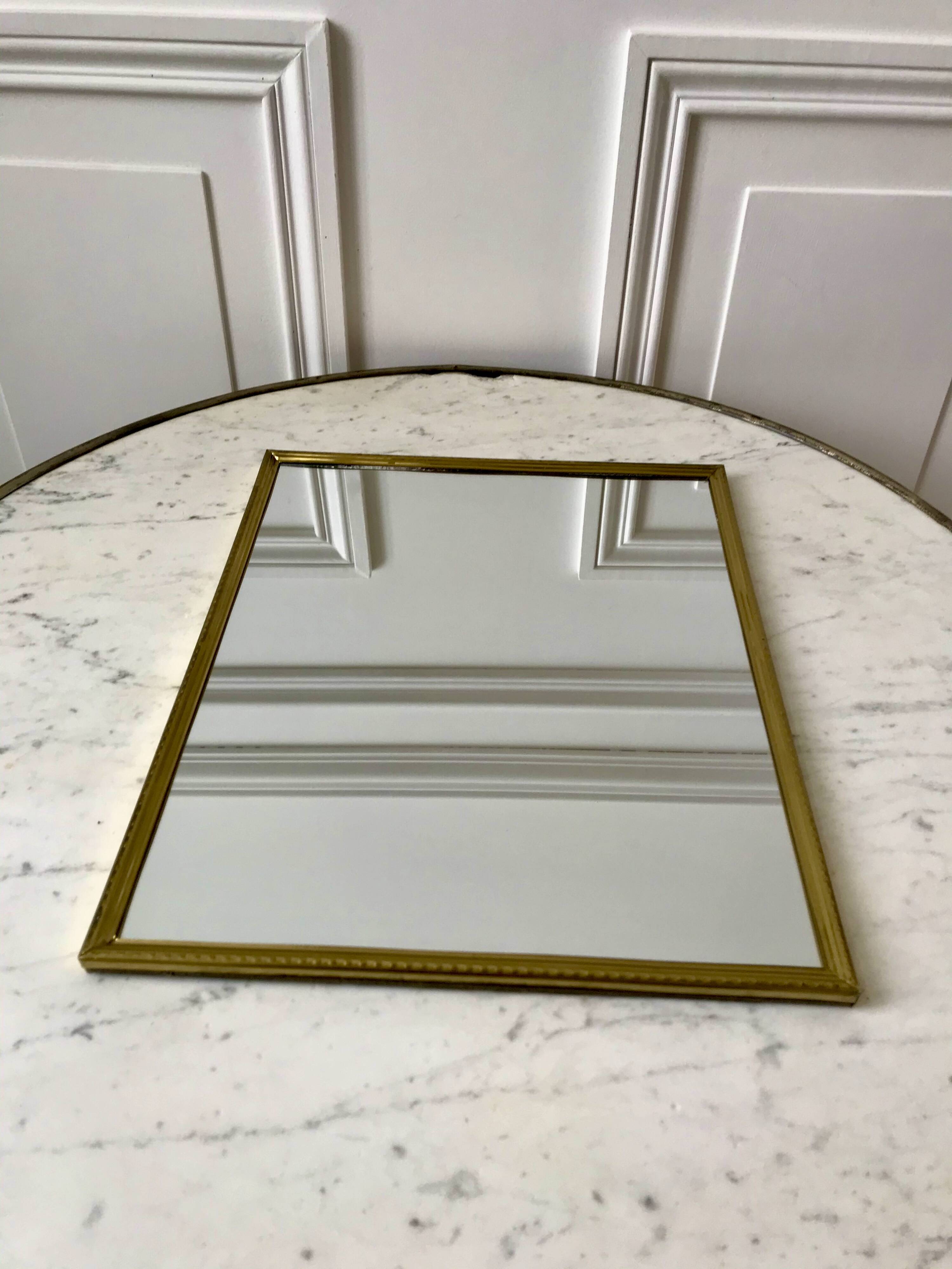 Gilded brass mirror from the 40s and 50s