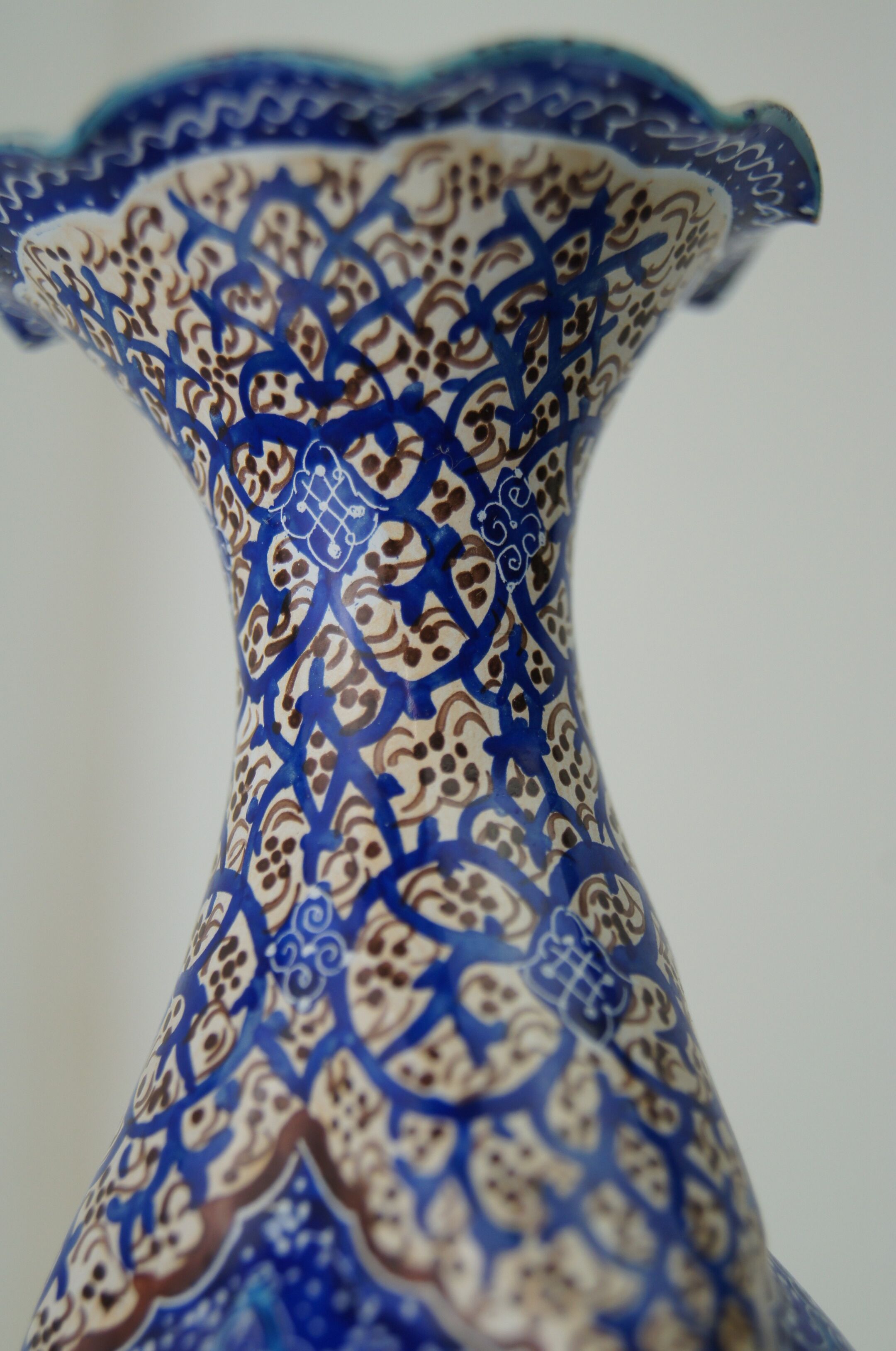 Piriform vase with a flared metal collar enamelled with a polychrome decoration, marked "Amini Iran" on the reverse.